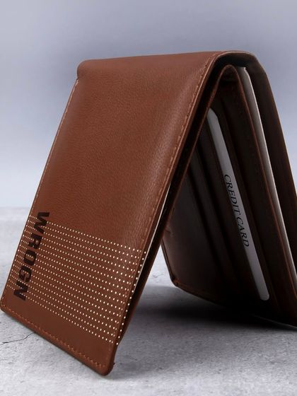 A standing shot of the dotted 'WROGN' wallet, showing its profile.