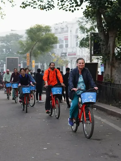 A group of riders enjoying the wide, empty roads of New Delhi in the morning. It's a peaceful and invigorating way to start the day.
