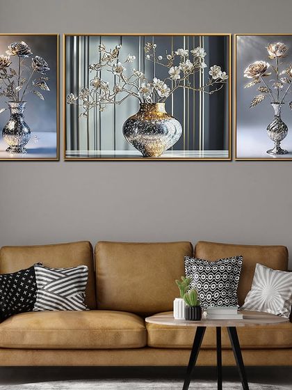 This triptych crystal glass painting features elegant floral arrangements in sparkling vases. The set of three panels creates a cohesive and sophisticated look, perfect for hanging above a sofa or console table.