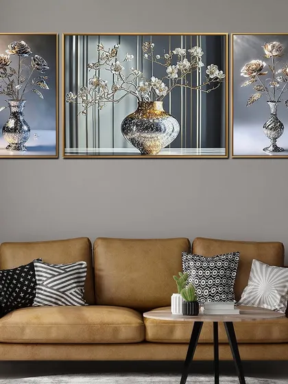 This triptych crystal glass painting features elegant floral arrangements in sparkling vases. The set of three panels creates a cohesive and sophisticated look, perfect for hanging above a sofa or console table.