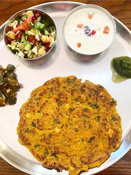 A healthy vegetarian meal doesn't have to be boring. This is a balanced thali I designed, featuring a paneer and methi roti, okra, a fresh chickpea salad, and mint chutney. My plans focus on making nutritious food delicious and satisfying.