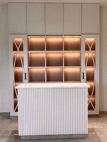 A custom-built home bar and library unit we delivered for a project by Aura Designgram. The design features clean lines, integrated lighting, and fluted details, blending functionality with sophisticated elegance.