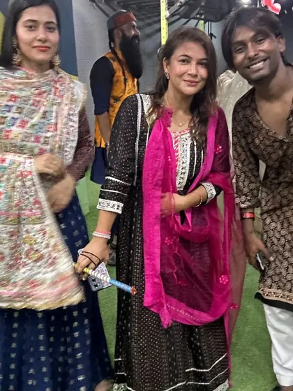 Friends and members posing for a photo during our Navratri Dandiya event. It's all about the community spirit.