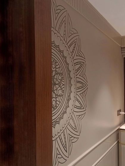 Another angle of the half-mandala mural, showing how it interacts with the room's architecture and wooden elements.