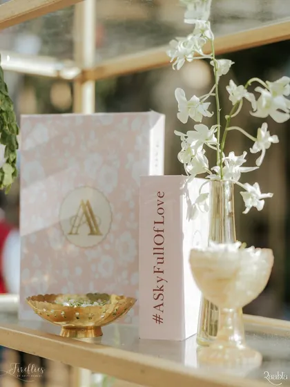 A personalized decor piece for Aashvi and Akash's wedding, featuring their monogram and wedding hashtag, #ASkyFullOfLove.