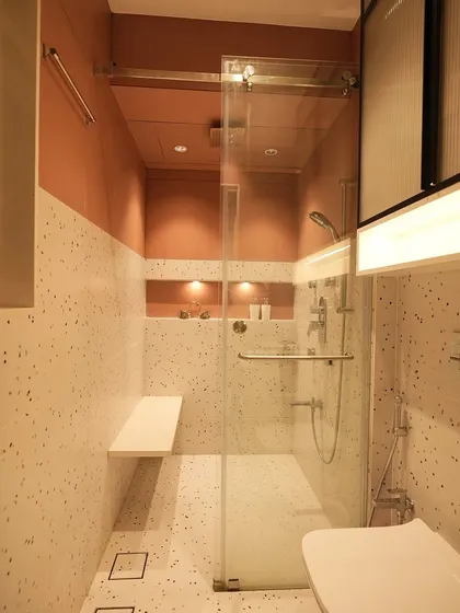 Another angle of the bathroom, highlighting the clean lines and functional layout that make the most of a narrow space.