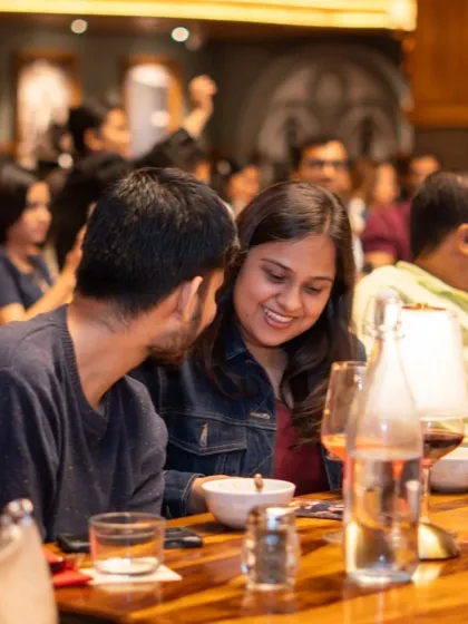 The heart of our experience is the shared moments of joy and connection. Here, guests enjoy a laugh during our screening in Bangalore, perfectly capturing the blend of fine dining, great cinema, and wonderful company that makes our evenings so special.