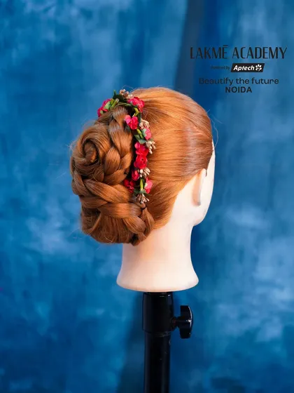 A side view of the floral rose bun, showing how the flowers are woven into the style.