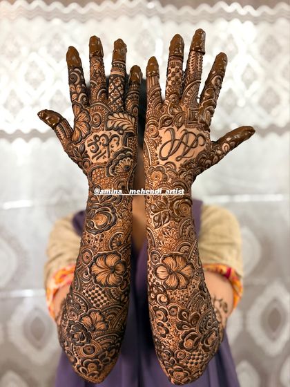 A full view of the design with the initials 'J' and 'A', surrounded by dense floral and paisley patterns.