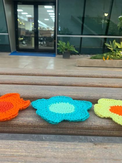 Here are the handmade flower coasters out in the wild. They are made with durable cotton yarn, making them both pretty and practical.