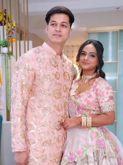 The happy couple on their engagement day. Her makeup was designed to look beautiful from every angle and last through the entire event.