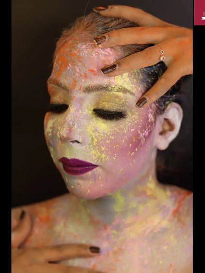 A creative makeup look for Holi, using colored powders to create a beautiful and expressive abstract design on the face.