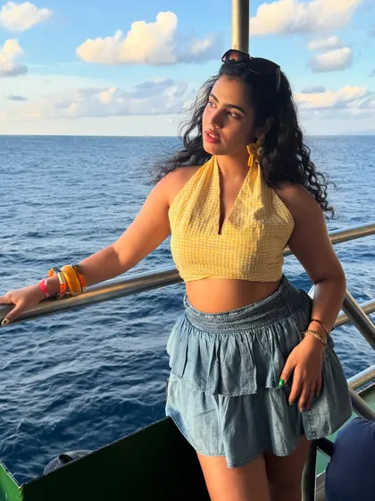 Reunited with vitamin sea. A sunny day on a cruise calls for a sunny outfit. I paired a yellow gingham halter top with a denim skirt and statement flower earrings for a fun, nautical-inspired look.