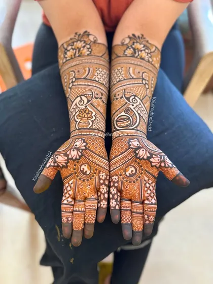 A full bridal design featuring a mix of traditional Indian motifs, including peacocks, kalash, and intricate jaali work.