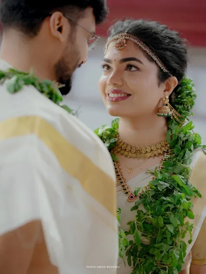 A beautiful close-up of the bride looking at her groom during their temple ceremony, her expression full of love and admiration.