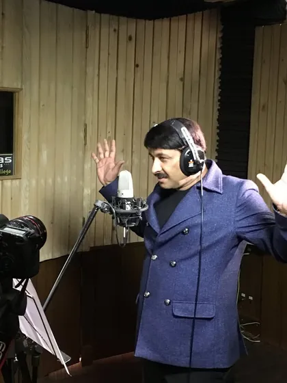 An expressive moment from a recording session with Manoj Tiwari ji. Our vocal booth is designed to provide acoustic isolation while allowing artists the freedom to perform.