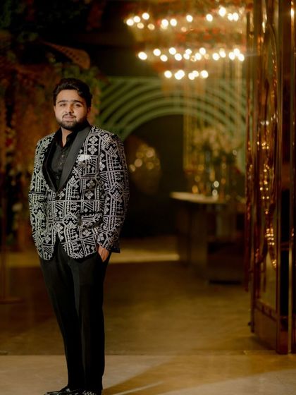 Another shot of our client in the patterned tuxedo, showcasing his confident stance and the impeccable fit of the suit.