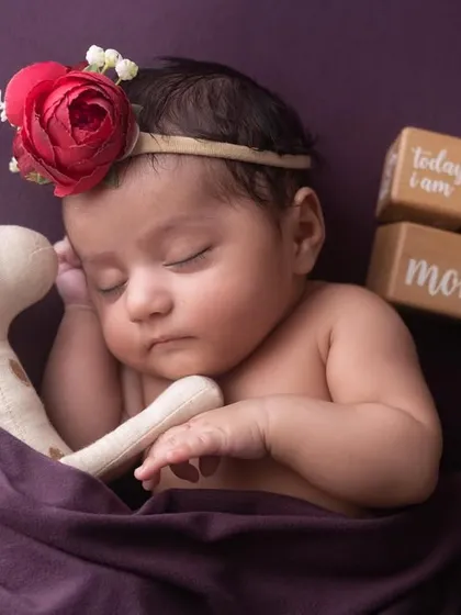 Two months old and sleeping soundly with a cuddly friend. I use age blocks to mark these precious milestones, creating a beautiful record of your baby's growth.
