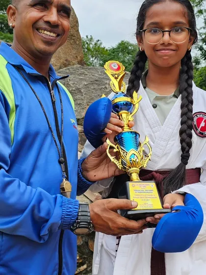 A proud moment with one of our female champions. We empower all our students to become strong, confident martial artists.