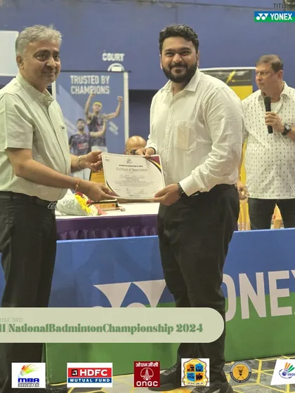 An official from the organizing committee being recognized. I work with a mix of experienced hands and young enthusiasts to manage my events.