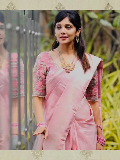 Actress Milana Nagaraj in a custom pink blouse with heavy silver embroidery on the sleeves. The delicate design adds a touch of glamour to the soft, elegant look.