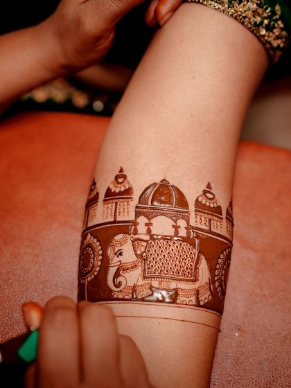 A behind-the-scenes shot of an elephant ambari being drawn. This shows the steady hand and artistic skill required to create such detailed traditional figures.