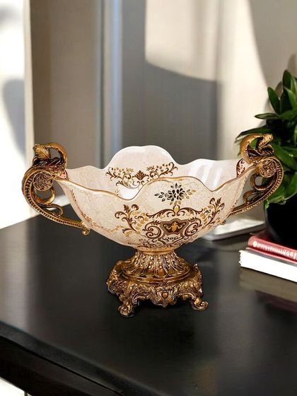 A wide, decorative Victorian bowl with elegant handles and a detailed base. This piece is perfect for holding potpourri or standing on its own as a statement of classic style on a console or coffee table.