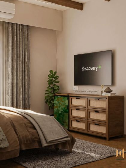 The TV unit in the industrial-vintage bedroom, featuring a wooden console with cane-fronted drawers and a unique green distressed-finish cabinet.