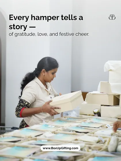 Every hamper I create tells a story of gratitude and love. Here, one of my team members carefully prepares a gift box, ensuring every detail is perfect.
