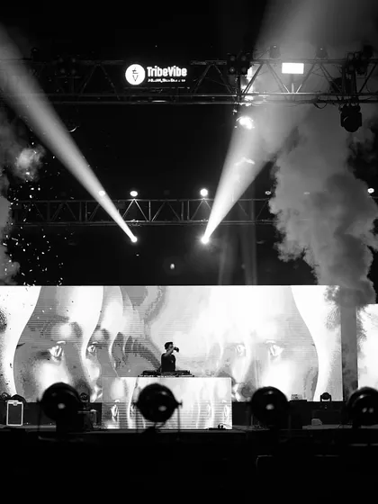 A wide, artistic shot of the stage at an IIT fest. The visuals on the LED screen and the dramatic lighting are part of the complete audio-visual experience I provide.
