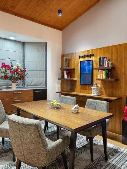 In the Valley of Dreams, this dining area is wrapped in the warmth of reclaimed wood. The custom dining table and our ergonomically crafted Ashton Chairs are framed by a large bay window, creating a corner that speaks of sustainability and slow living.