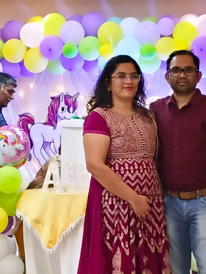 A happy family posing in front of our unicorn-themed balloon arch. Our goal is to create beautiful backdrops that bring families together for cherished photos.