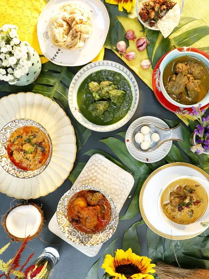 A beautiful flat-lay of the vibrant buffet we offered during our Kerala-themed pop-up. The spread includes a variety of our signature curries, breads, and vegetarian dishes, showing the diversity of our cuisine.