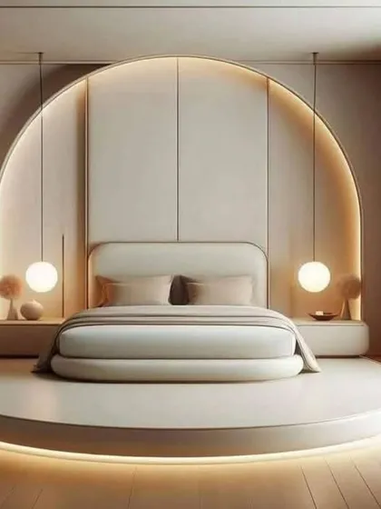 A unique bedroom design featuring a circular platform bed with integrated lighting. The arched alcove and hanging spherical lights create a cozy and futuristic feel.