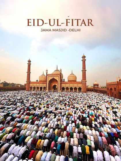 A ground-level wide shot of thousands of worshippers bowing in unison during Eid prayers at Jama Masjid, creating a powerful image of collective faith.