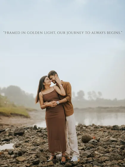 "Framed in golden light, our journey to always begins." A beautiful, intimate portrait of the couple by a riverbank, bathed in the warm glow of the sun.