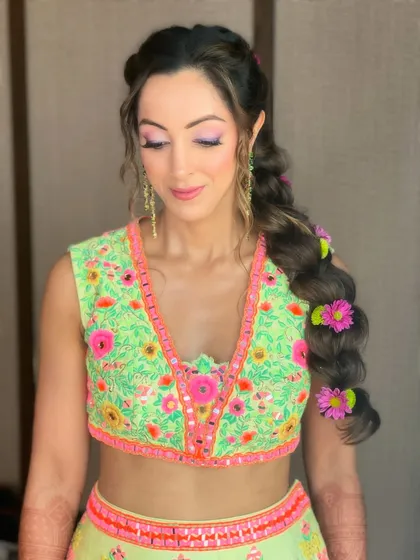 Another angle of the mehendi braid, showing off the beautiful details and the client's happy expression.