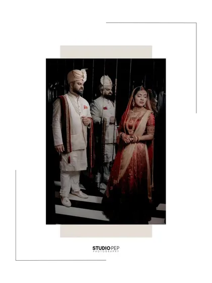 An artistic shot of the couple, their reflection captured in a mirror, creating a moody and sophisticated portrait.