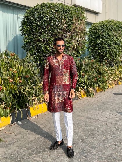 A full shot of my baraat look in Daman. The combination of a stylish kurta and classic white pants is a go-to for daytime wedding events.