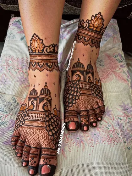 I create elaborate and clean mehandi designs for feet, featuring traditional architectural and peacock motifs that provide a complete and elegant bridal look.