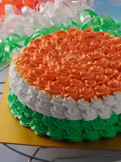 Our Dutch Truffle Tiranga Cake is another patriotic option, featuring rich chocolate cake decorated with saffron, white, and green rosettes.