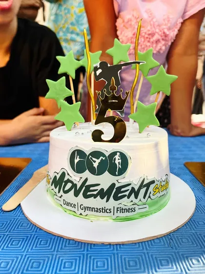 Every milestone is special, and we celebrate them with cake. This custom cake for our studio's 5th anniversary shows our core pillars: Dance, Gymnastics, and Fitness.