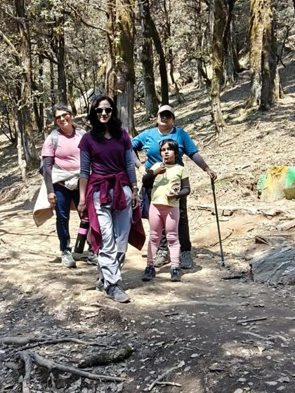 A family enjoying a walk through the dense forests of Jibhi. My trips are safe and enjoyable for all age groups.