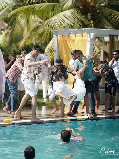 More fun from a pre-wedding pool party, with the groom's friends getting ready to toss him into the water. It's all about capturing the celebration.