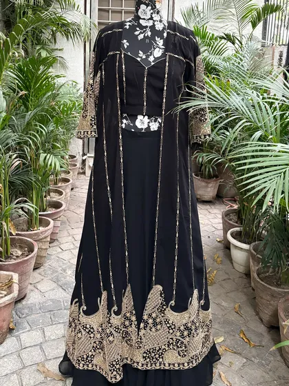 The full view of the black and gold jacket set. This is a versatile piece that can be styled in many ways.