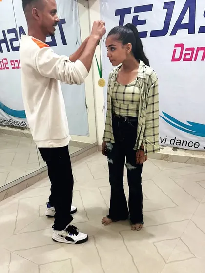 Awarding a medal to one of my most dedicated students. Her progress has been amazing, and this is just the beginning for her. Congratulations!