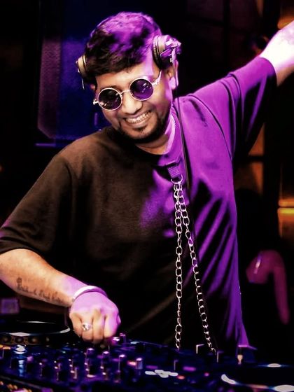 An energetic pose while mixing. The show must always go on.