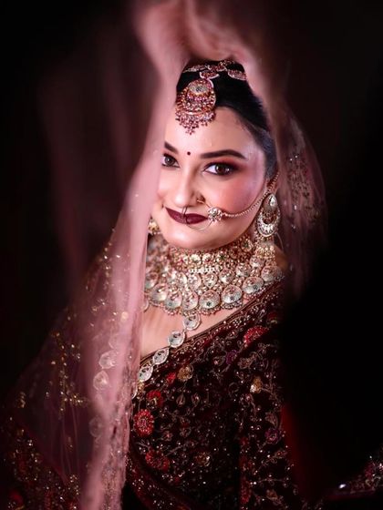 A beautiful close-up of my bride Disha, peeking through her veil. Her dark lipstick and smokey eyes look so glamorous.