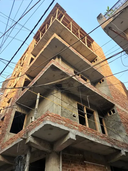 The same 22'6"x30' project during the construction phase. This image shows the bare concrete and brick structure, providing a direct comparison to the final render and showcasing our ability to translate design into reality.