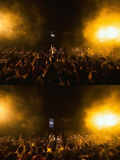 The crowd bathed in golden light. The production for this Delhi show was all about creating a warm, immersive, and powerful visual experience.